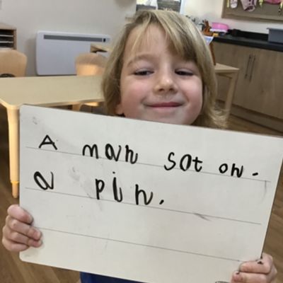 Child Holding Paper