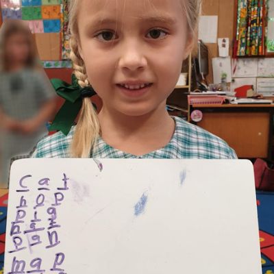 Child Holding Paper