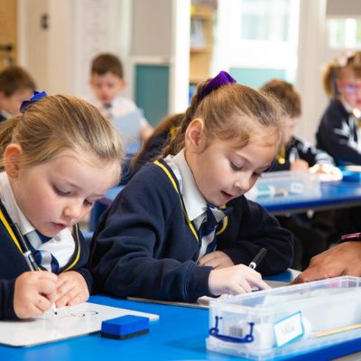 Two Kids At Desk