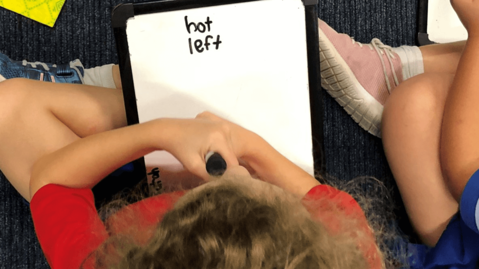 Children with whiteboards