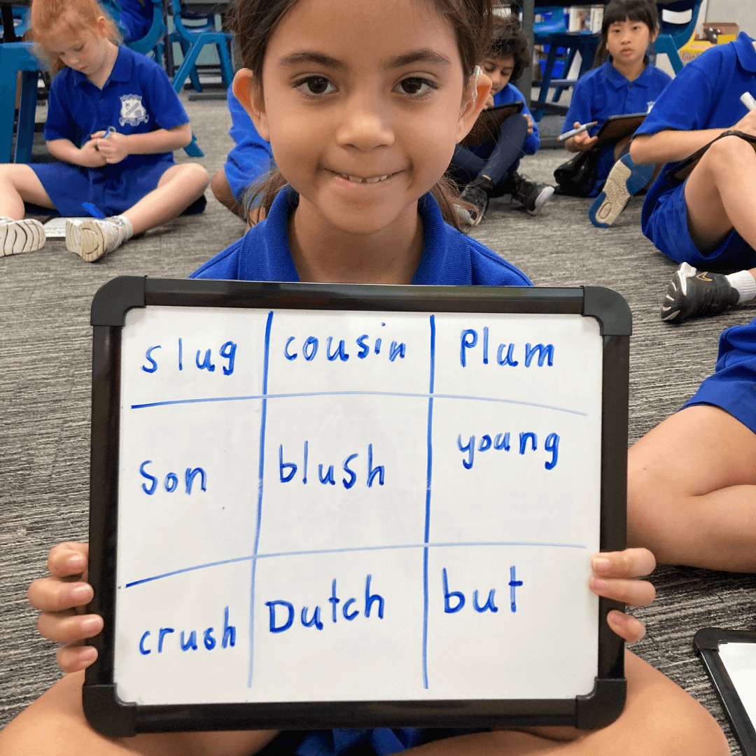 Child Pointing at Whiteboard