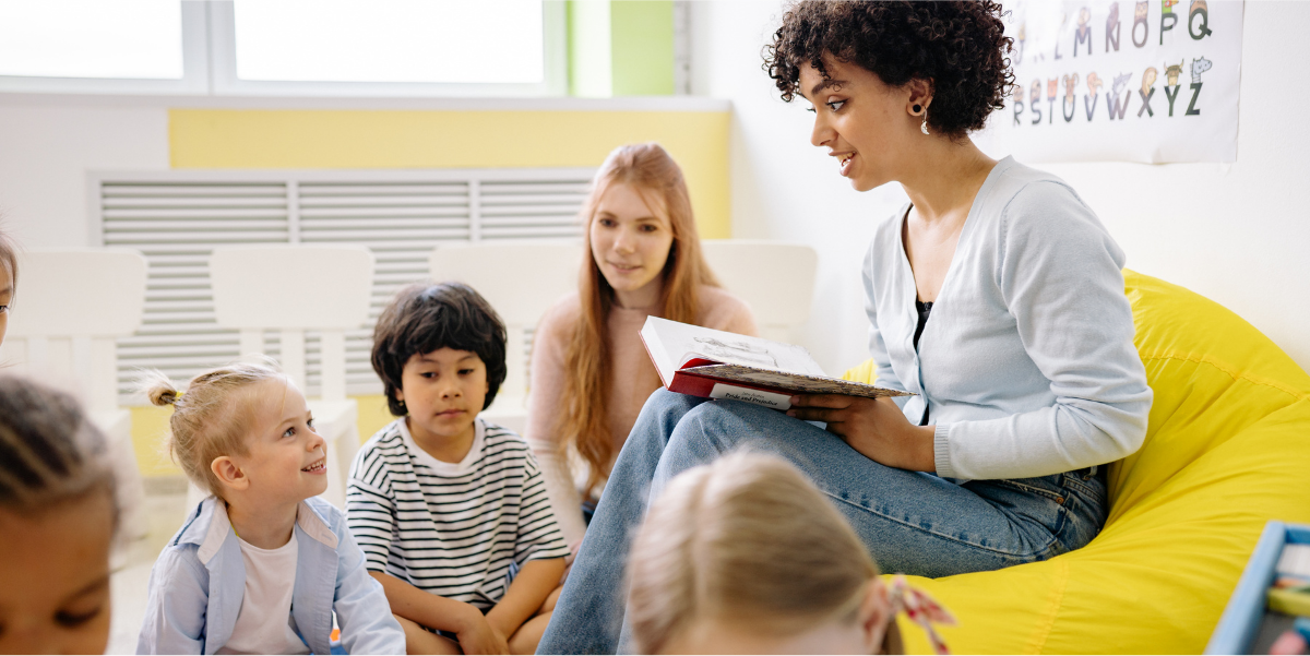 Deliver Scripted, Practical Lessons Teacher reading from a book