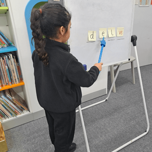 Waulud Primary School Phonics Case Study Child practising phonics at Waulud Primary School