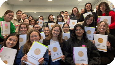 Group of Sounds-write trainees show their certificates